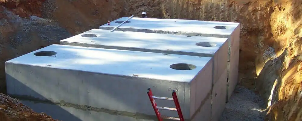 Septic tank installation site with a newly placed concrete tank in Omaha, NE